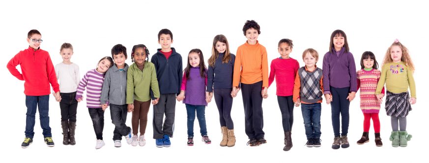 Group of children holding hands isolated in white